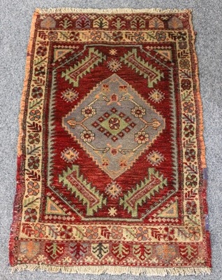 Lot 1013 - Turkish Yastik Rug, the deep blood red field...