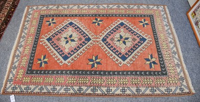 Lot 1008 - Turkish Rug, the faded terracotta field with...