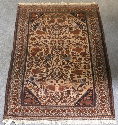 Lot 1002 - Baluch Rug, the camel ground with winged...