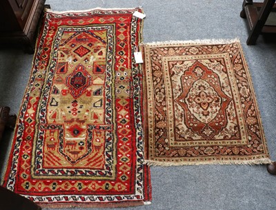 Lot 1009 - Haji Jalili Rug, the madder field with central...