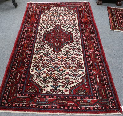 Lot 1010 - Hamadan Rug, the ivory field of geometric...