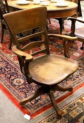 Lot 1416 - An Oak Swivelling Office Chair