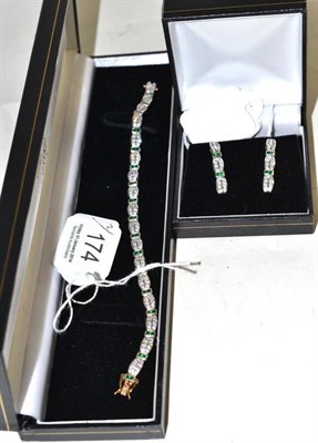 Lot 174 - A 9ct gold bracelet and a pair of matching drop earrings, set with green and white stones