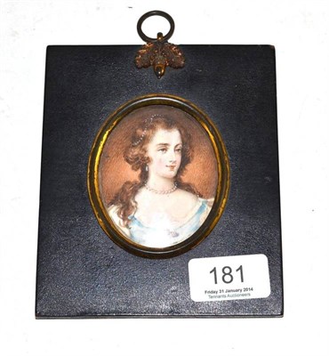 Lot 181 - Portrait miniature of a young woman, oval, in papier mache frame