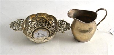 Lot 182 - White metal two handled bowl and a silver jug