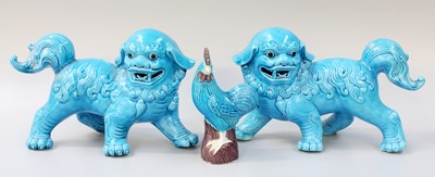 Lot 203 - A Pair of Chinese Porcelain Models of Lion...
