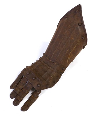 Lot 120 - A 17th Century Steel Gauntlet, the fluted...