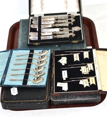 Lot 214 - A set of cased sandwich flags, cased nutcrackers, plated cake forks and tea knives