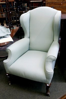 Lot 1359 - A Queen Anne Style Wing Back Armchair, with...