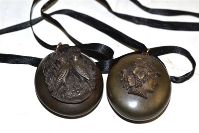 Lot 243 - Two jet pendants