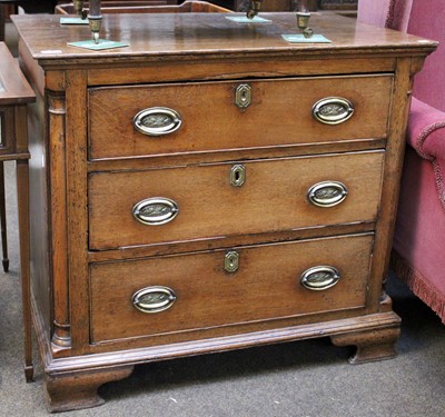 Lot 1318 - A George IV Oak Three Height Chest of Drawers,...