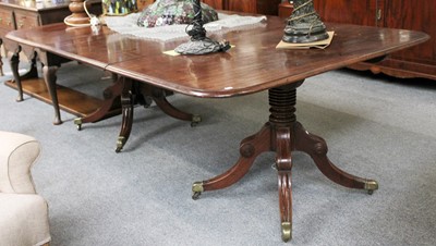 Lot 1146 - A George III Mahogany Twin Pillar Dining Table,...