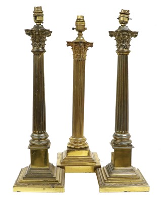 Lot 339 - A Pair of Gilt Metal Table Lamps, in the form...