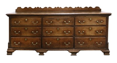 Lot 1091 - A George III Oak Enclosed Dresser Base, 3rd...