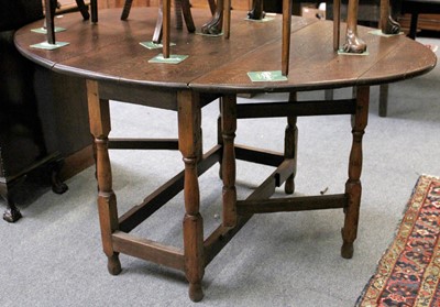 Lot 1240 - An 18th Century Oak Gateleg Dining Table,...