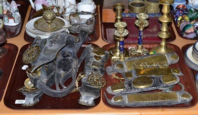 Lot 282 - Assorted horse brasses on original leathers, brass candlesticks etc (two trays)