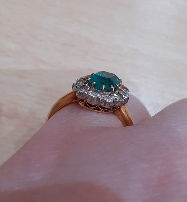 Lot 2093 - An Emerald and Diamond Cluster Ring the...
