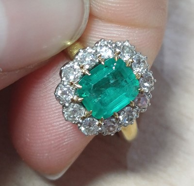 Lot 2093 - An Emerald and Diamond Cluster Ring the...