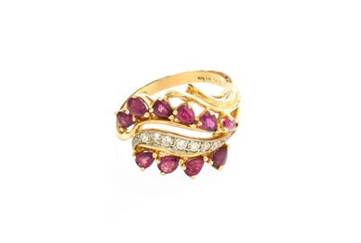 Lot 213 - A 14 Carat Gold Ruby and Diamond Ring, a row...