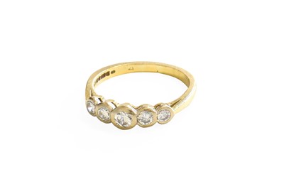 Lot 215 - An 18 Carat Gold Diamond Five Stone Ring, the...