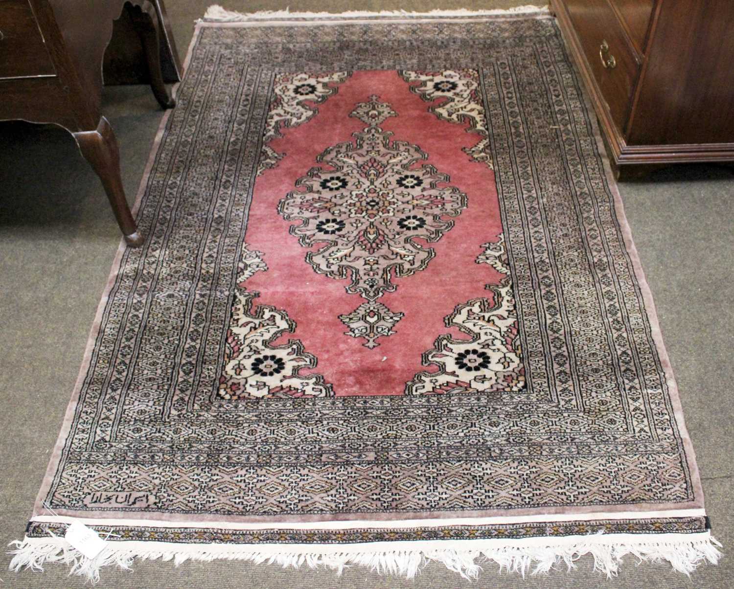 Lot 1163 Signed Lahore "Bukhara" Rug, the field with
