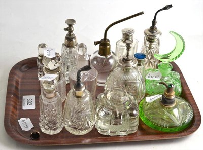 Lot 302 - A quantity of assorted mainly cut glass scent bottles, some with sterling mounts