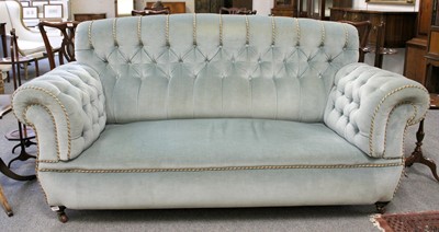 Lot 1268 - A Late Victorian Sofa, with button back and...