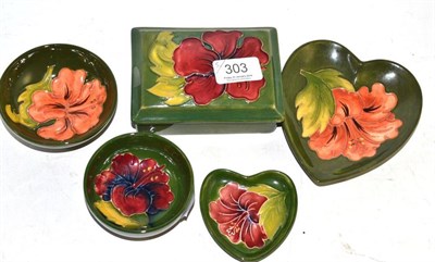 Lot 303 - A Moorcroft pottery heart shaped pin dish, another similar, two small bowls and a lidded...