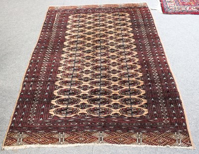 Lot 1145 - Pakistani "Bukhara" Rug, the sand field with...