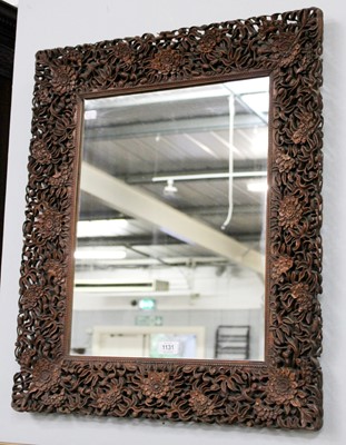 Lot 1131 - A Chinese Mirror, with an ornately carved...