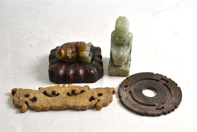 Lot 308 - A group of four Chinese jade/jadeite items including a crouched lion (one wood stand)