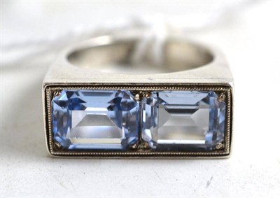 Lot 312 - A light blue spinel set ring (probably synthetic spinel), stamped '900', finger size M