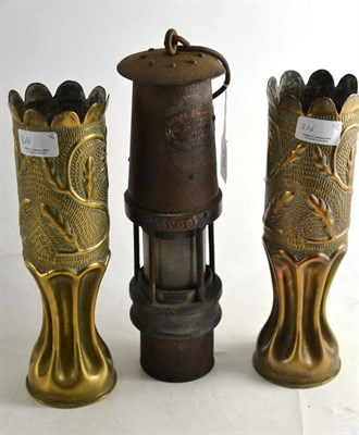 Lot 316 - A pair of Trench art vases and a miners lamp (3)