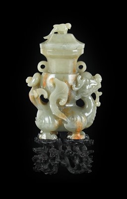 Lot 4 - ~ A Chinese Celadon and Russet Jade Figural...