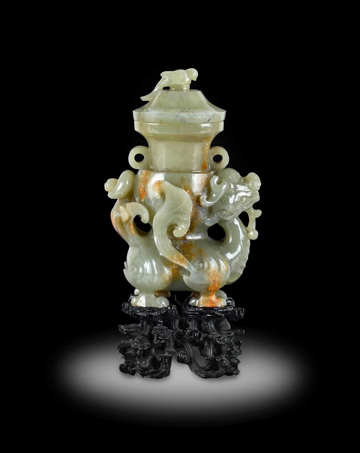 Lot 4 - ~ A Chinese Celadon and Russet Jade Figural...