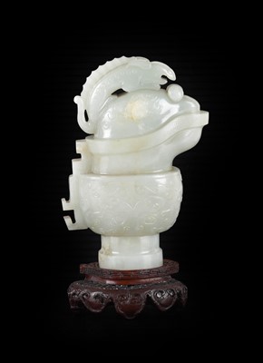 Lot 49 - ~ A Chinese Archaistic Celadon Jade Ewer and...