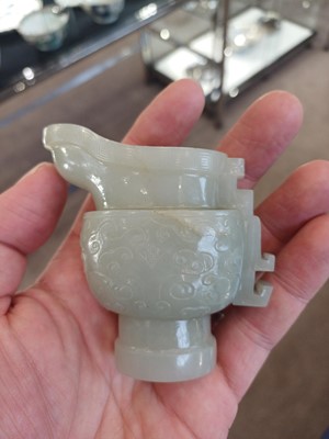 Lot 49 - ~ A Chinese Archaistic Celadon Jade Ewer and...