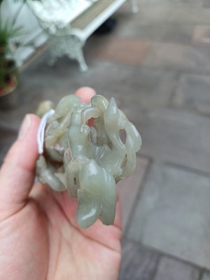 Lot 7 - ~ A Chinese Pale Celadon and Russet Jade Vase,...