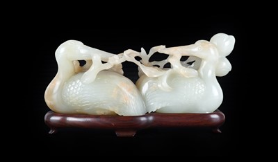 Lot 8 - ~ A Chinese Pale Celadon and Russet Jade Group,...
