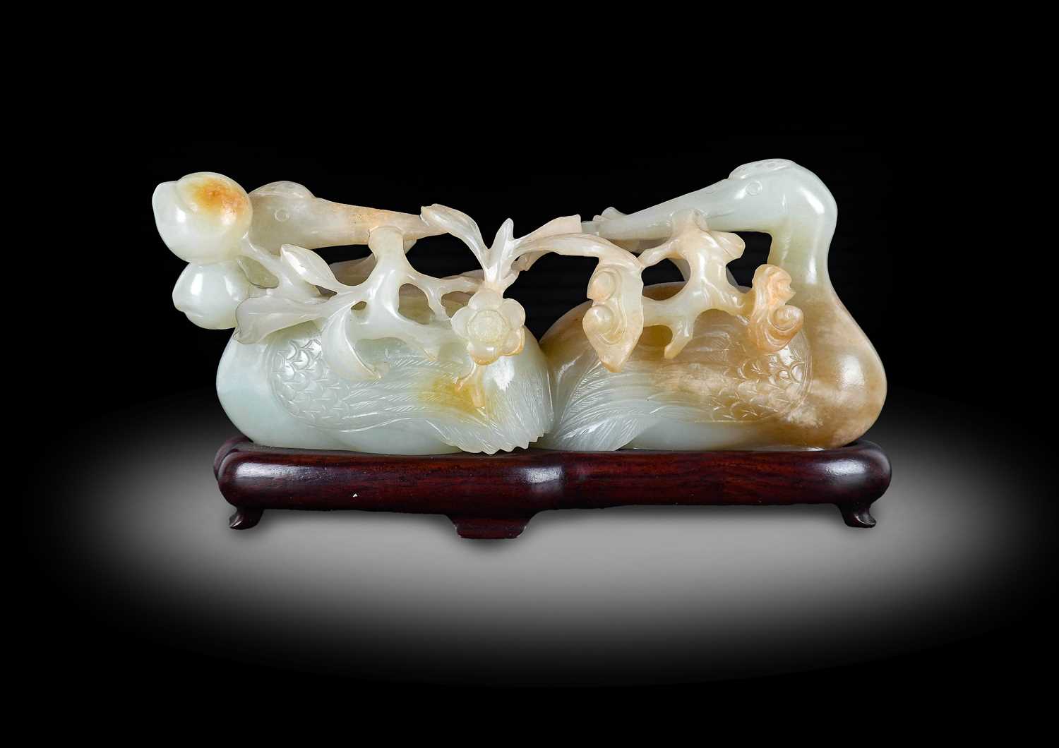 Lot 8 - ~ A Chinese Pale Celadon and Russet Jade Group,...