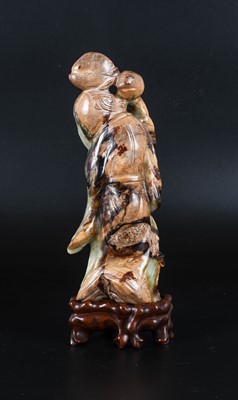 Lot 53 - ~ A Chinese Pale Celadon and Mottled Brown...