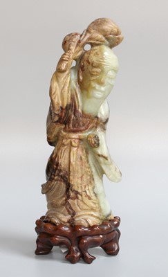 Lot 101 - A Chinese Pale Celadon and Mottled Brown Jade...
