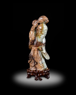 Lot 126 - A Chinese Pale Celadon and Mottled Brown Jade...