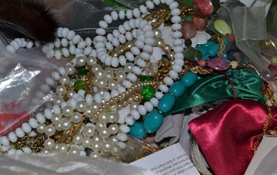 Lot 335 - A box of assorted costume jewellery, including beads, bangles, brooches and earrings, silver...