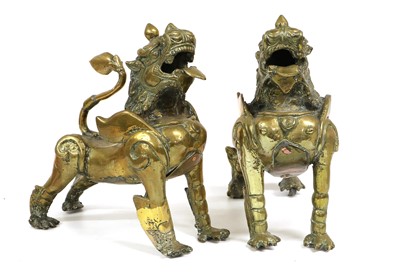 Lot 231 - A Pair of Chinese Brass Figures of Temple...