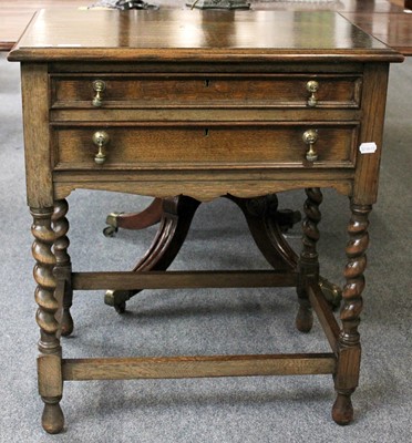 Lot 1147 - A 1920s Oak Two Drawer Canteen Table, with...