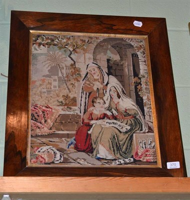 Lot 370 - Rosewood framed Victorian woolwork and petit point needlework picture of two figures and a child