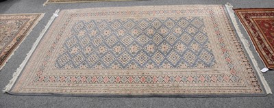 Lot 1001 - "Bukhara" Rug, the steel blue diamond lattice...