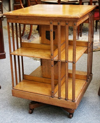 Lot 1111 - An Oak Edwardian Revolving Bookcase, bearing...