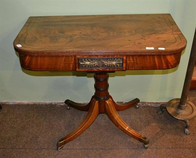 Lot 393 - A Georgian mahogany side table with a brass plaque to the front